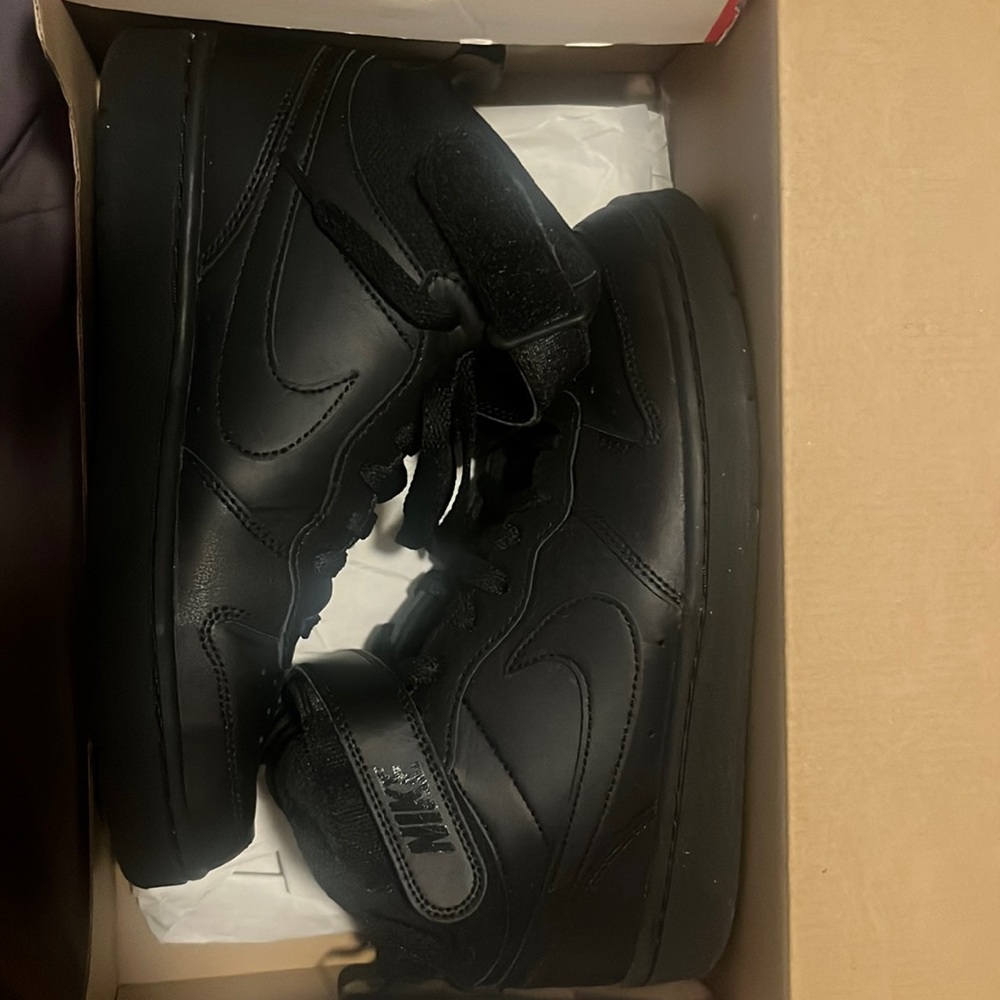Black Nike high tops.